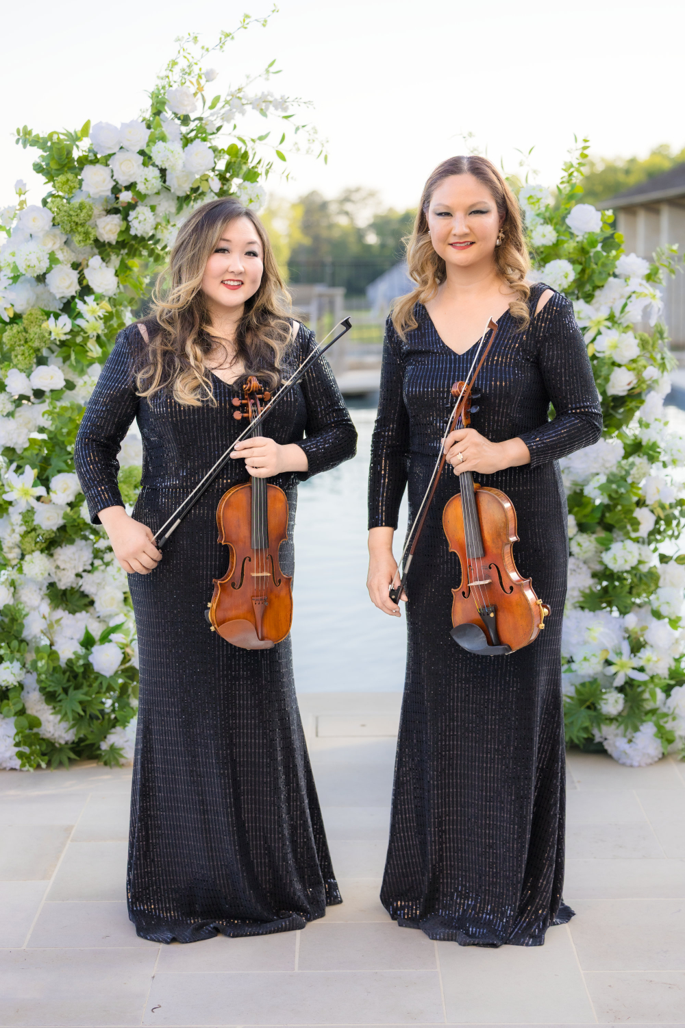 Bows & Roses violinists performing together